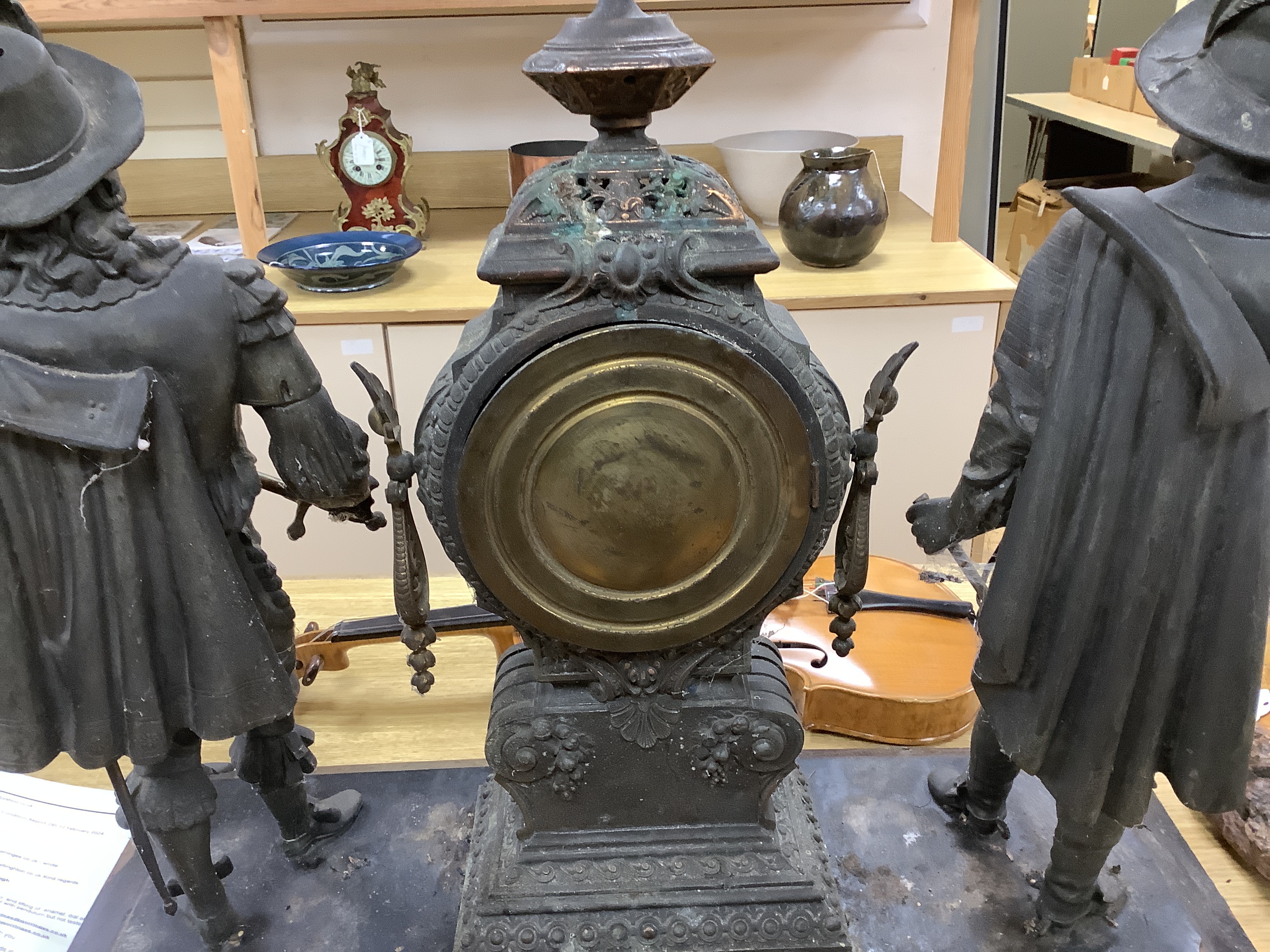 A 20th century American spelter and Cavalier figural mantel clock, 52cm high